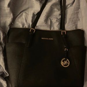 Black Michael Kors bag and wallet set